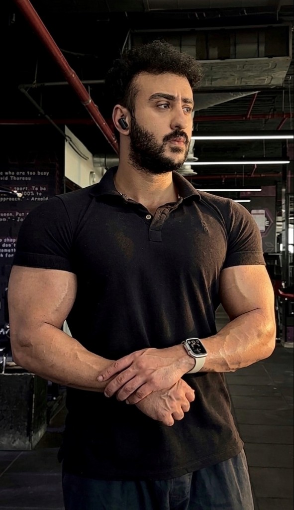 Dagher Mahmoud standing arms crossed.
