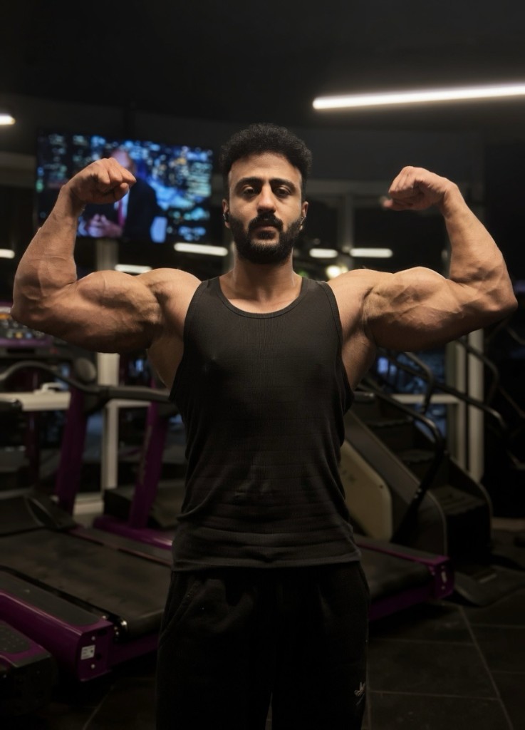 Dagher Mahmoud double-bicep pose.